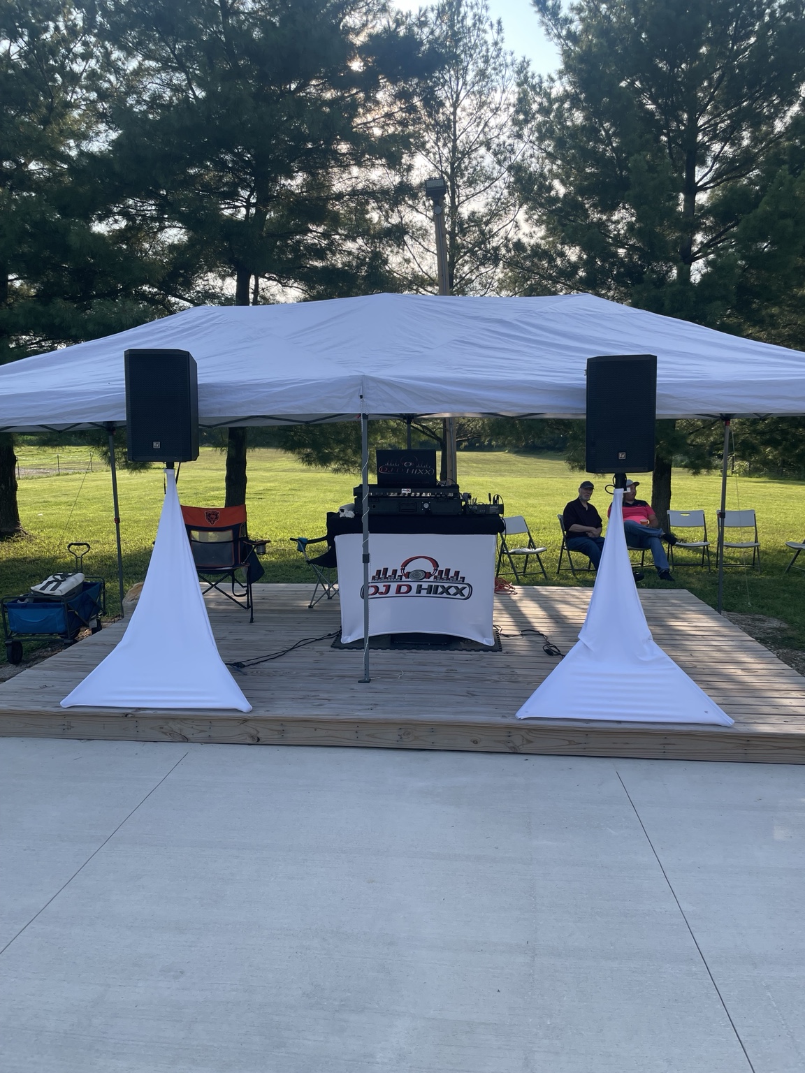 Derrick Hicks performing behind his DJ booth